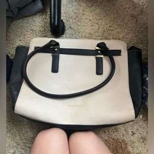 It has several pockets, very roomie purse! Tan and black